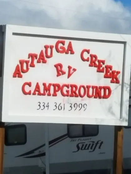 The campground's roadside sign with the phone number 334-361-3999
